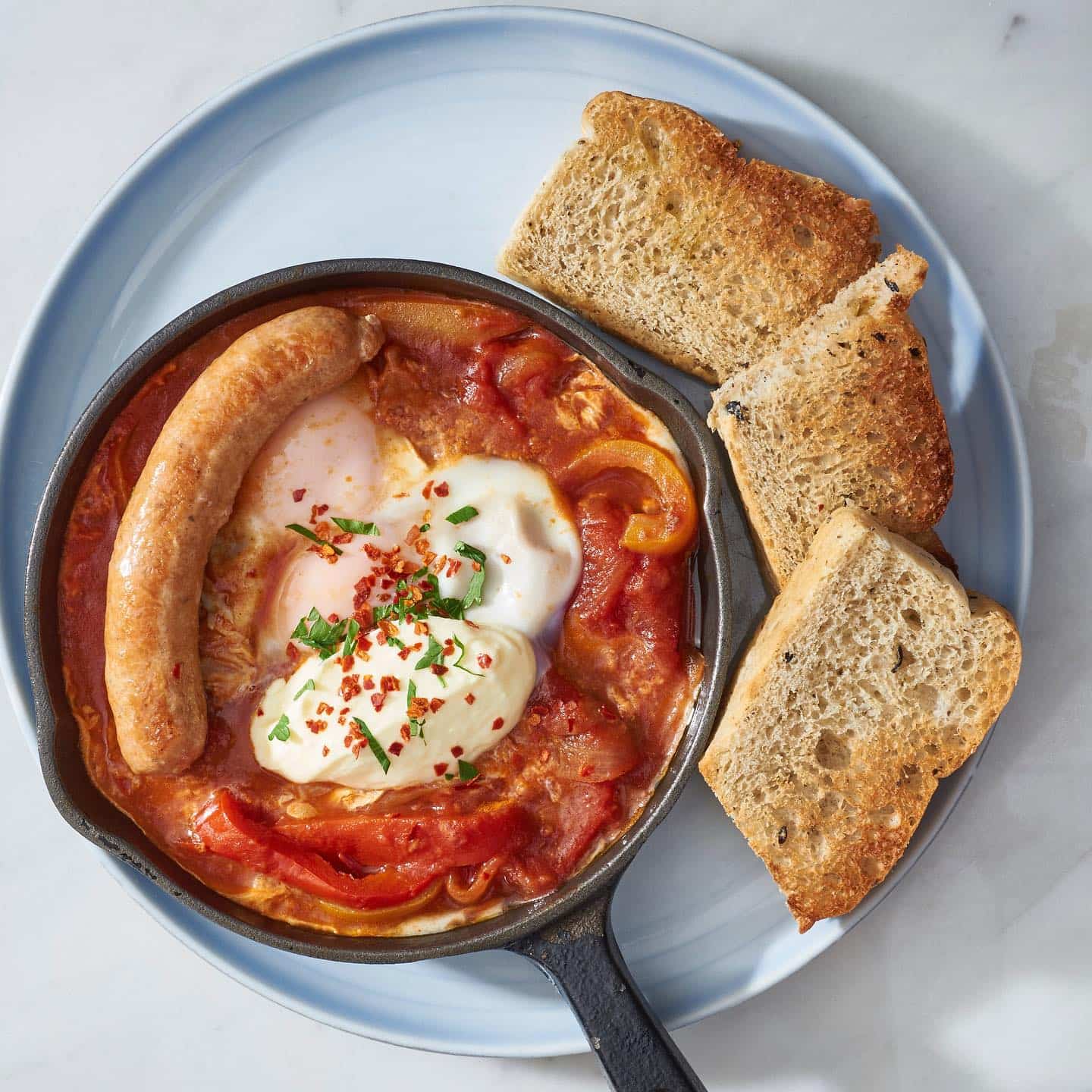 Shakshuka with sausage and toast