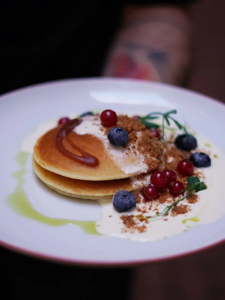 pancakes with blueberries and maple syrup from coffee and riot coffee shop in old town prague czech republic