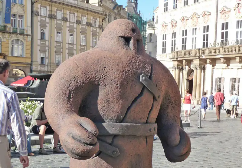 a statue of the clay golem of prague in old town square prague czech republic