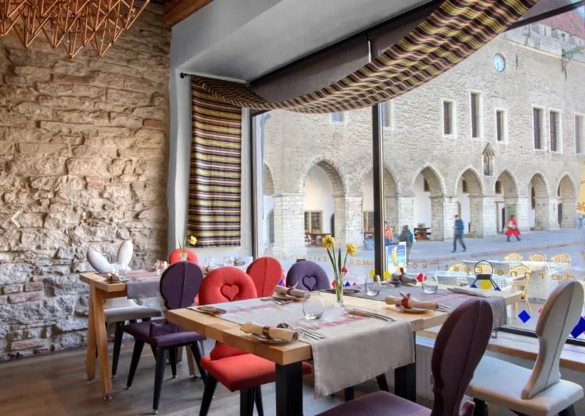 The interior of Kaerajaan restaurant with a few to the Old Town through the window
