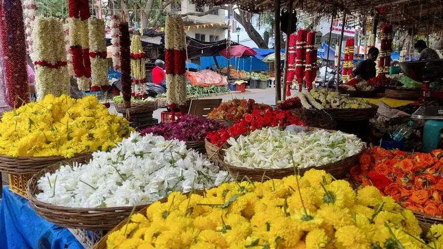 Market with flower vendors in Bangalore, India