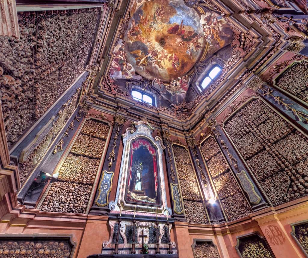 The human skulls lining the walls of San Bernardino alle Ossa church