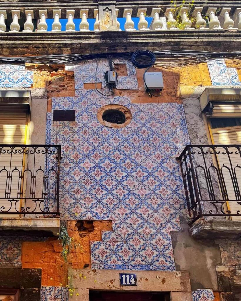 Random buildings in Lisbon displaying azuljou tiles