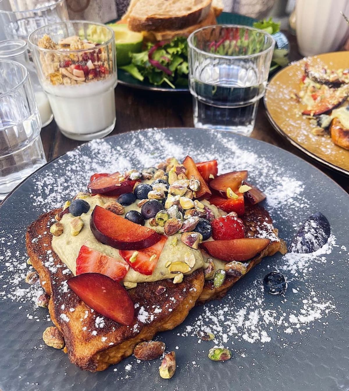 french toast with fresh berries from floresta cafe by hungry biker in porto portugal