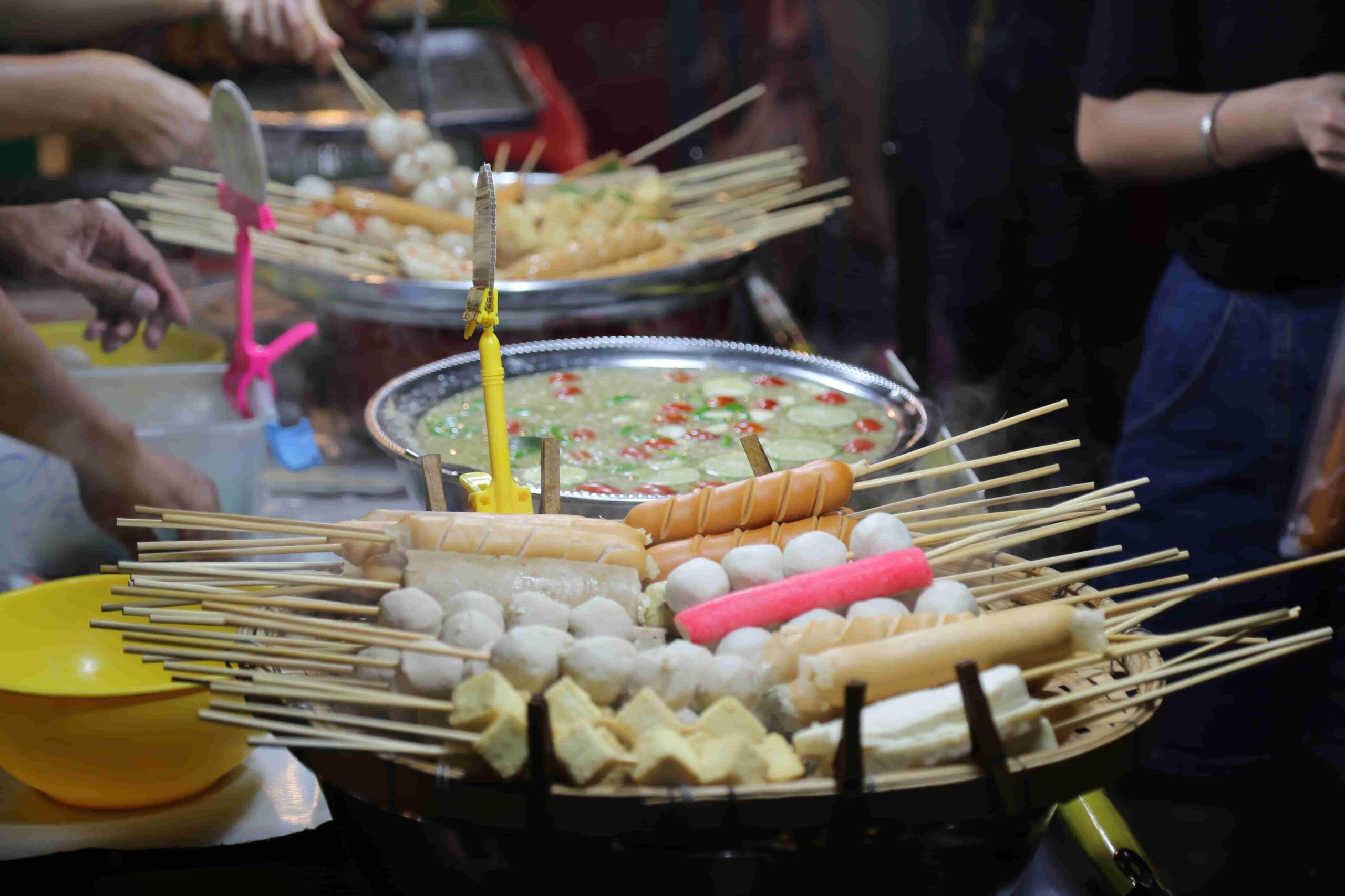 Satay sticks, ranging from fish balls to sausages to tofu