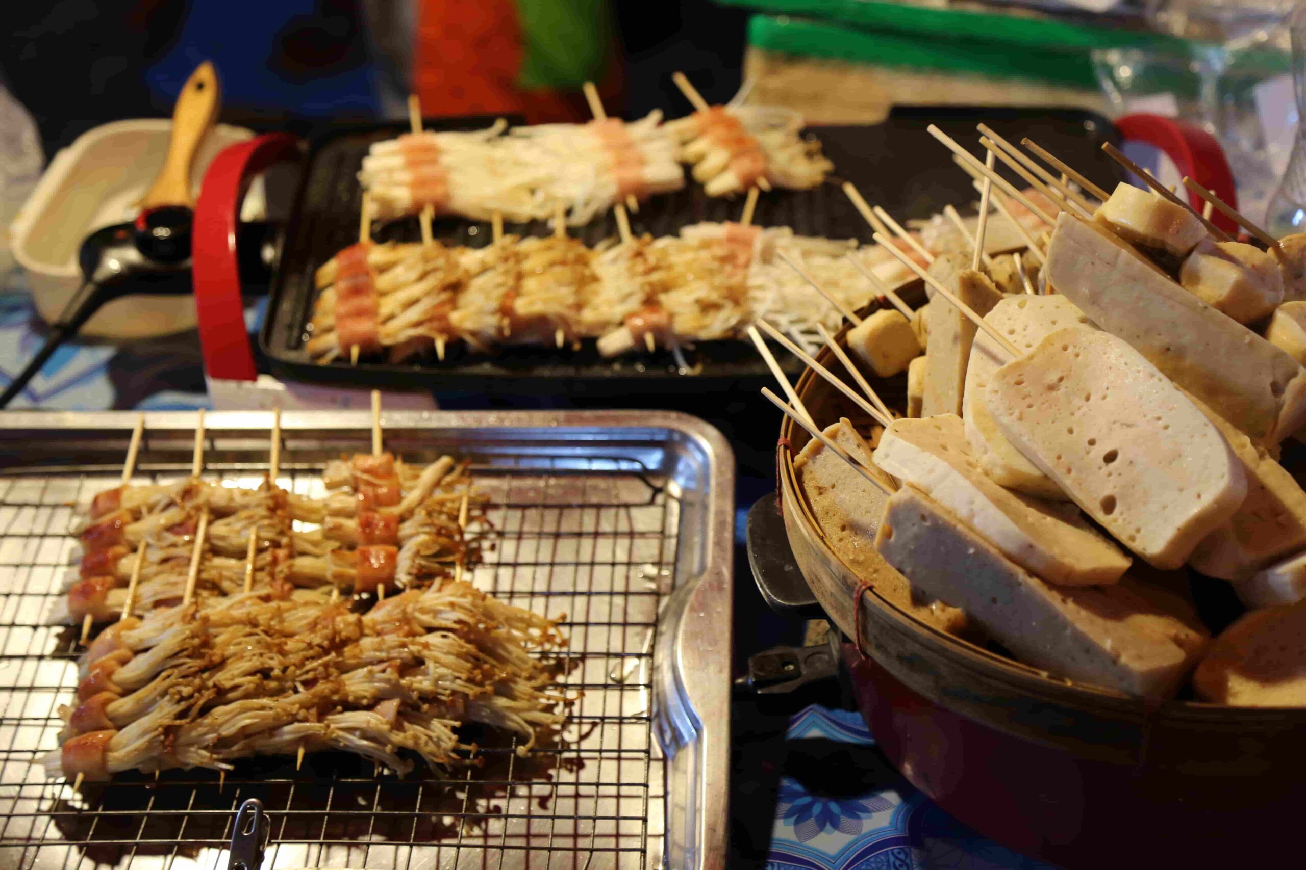 Skewered mushrooms on satay sticks and tofu at the night market in Chiang Mai