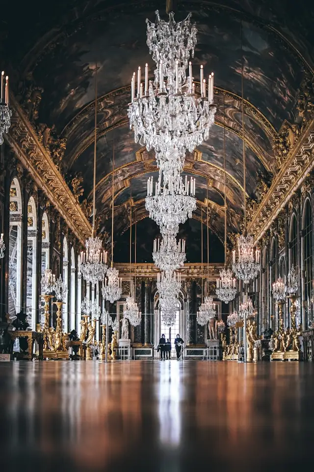 the hall of mirrors a long gallery with chandeliers in the palace of versailles paris france