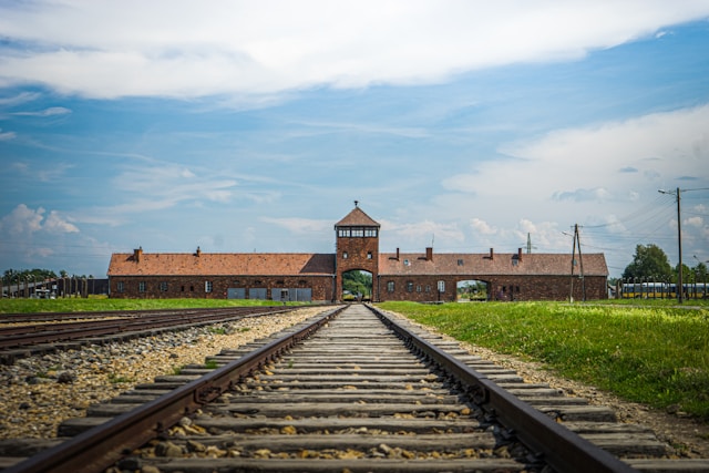 a railway line leading to the entrance of auschwitz nazi concentration camp in poland