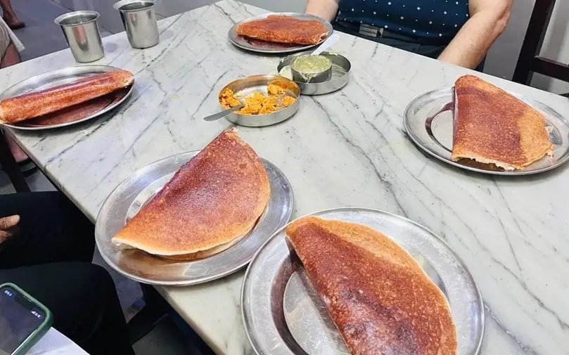 Plates of Masala Dosa on a table in a restaurant in India