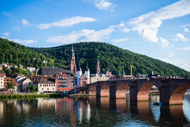 colorful houses on the banks of the river neckar next to a bridge in heidelberg germany