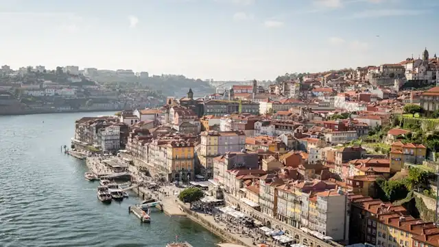 a cluster of old buildings in riberia old town of porto portugal on the banks of the Douro river