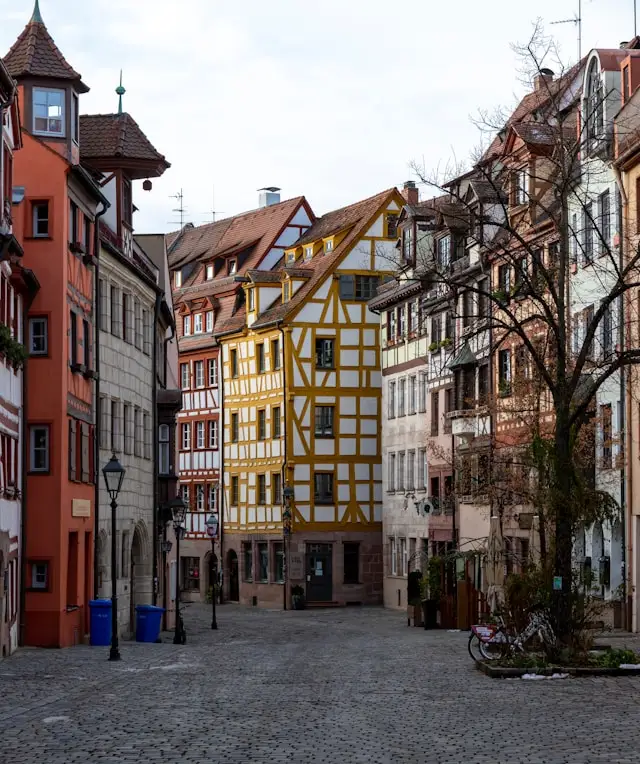colorful historic buildings on a cobbled street in nuremberg germany