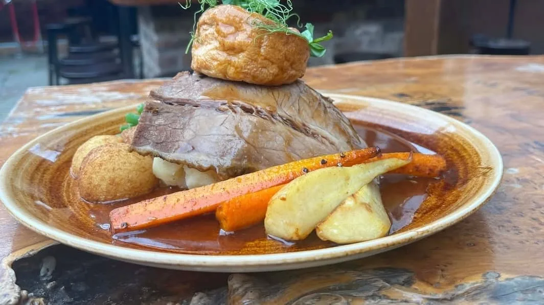 Classic Sunday roast with lamb, Yorkshire pudding, carrots, potatoes