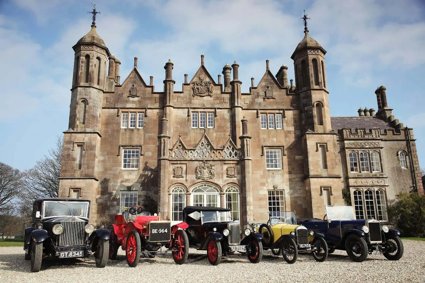 The entrance of Glenarm Castle with vintage cars out front
