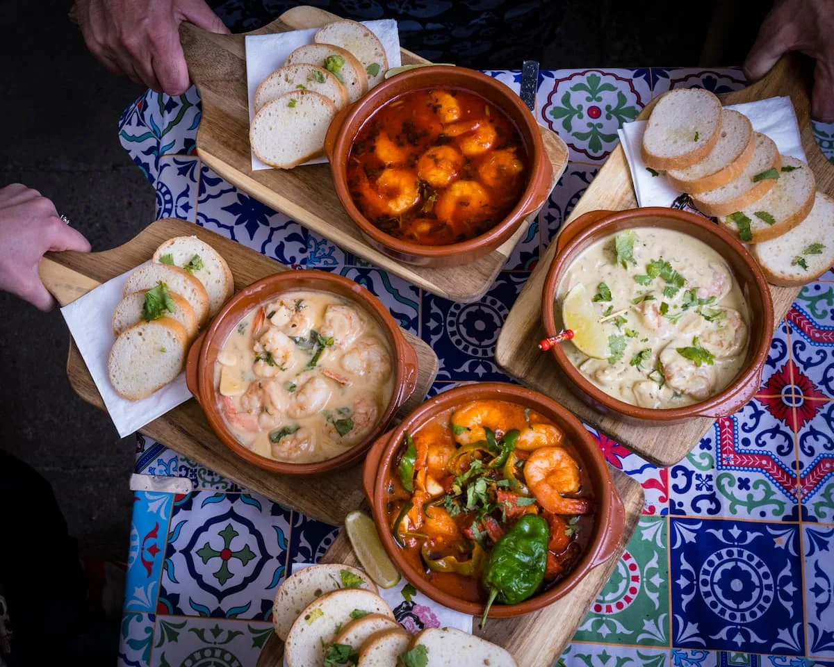a selection of tapas in ceramic dishes from hola tapas in gdansk poland