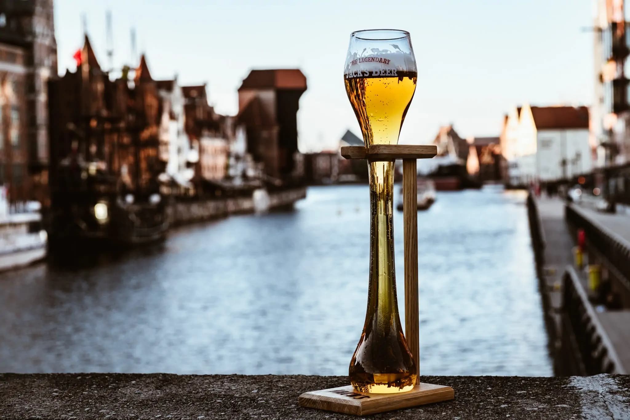 a liter glass of jack's beer in front of the motlawa river in gdansk poland
