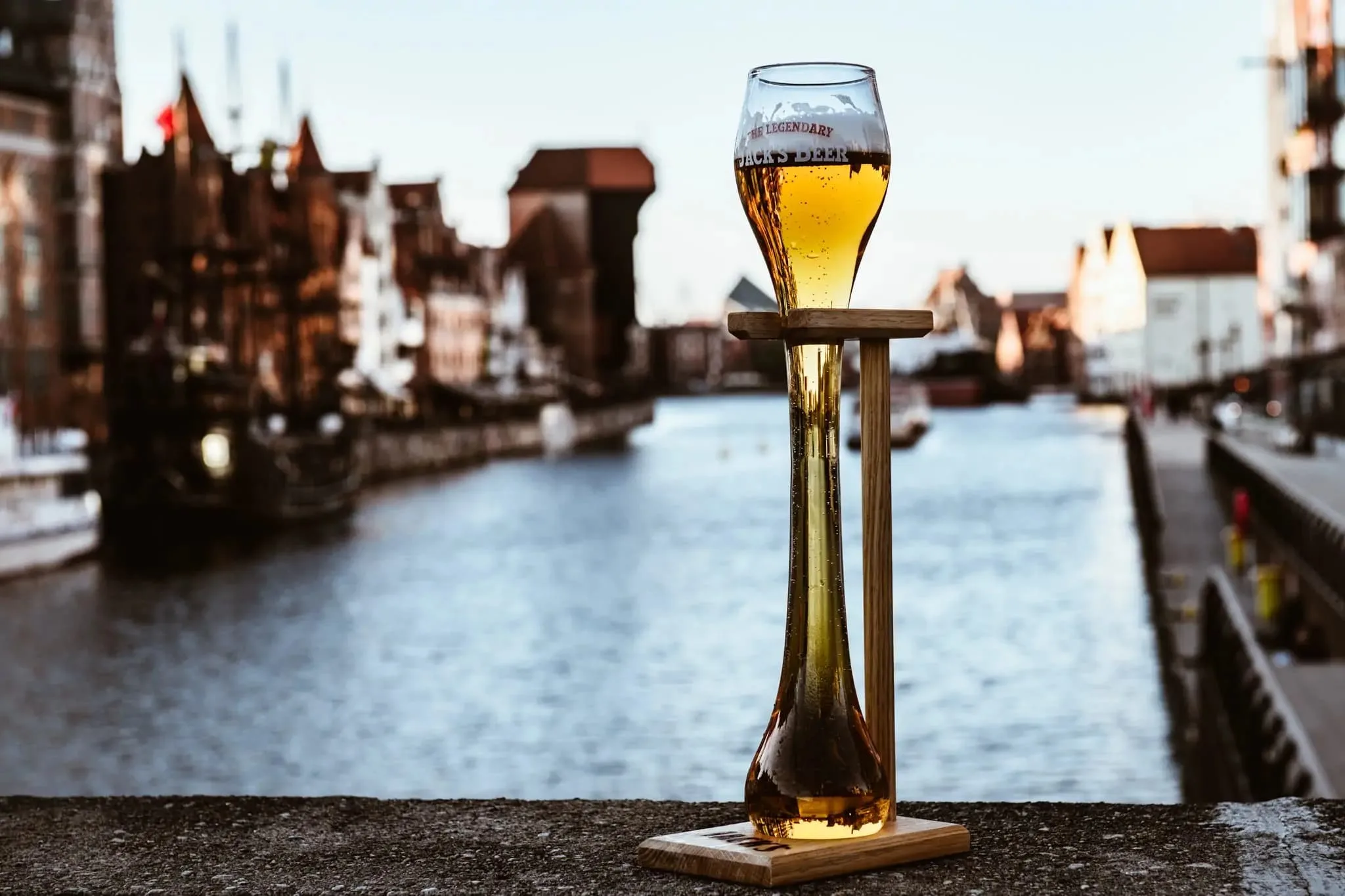 a liter glass of jack's beer in front of the motlawa river in gdansk poland