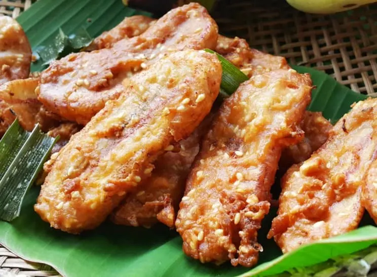 Thai fried bananas are served on a banana leaf in Thailand