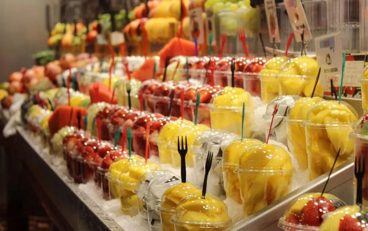 Rows of fresh fruit cups in Phuket