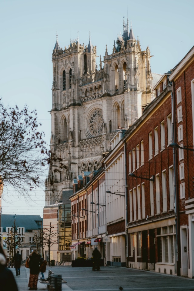 gothic amiens cathedral behind a row of houses in the somme northern france