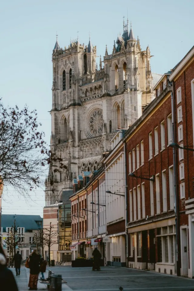gothic amiens cathedral behind a row of houses in the somme northern france