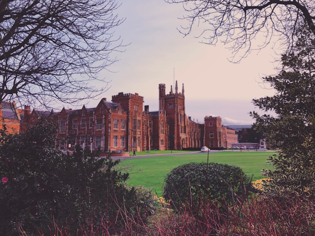 queens university belfast with a grass lawn in the foreground
