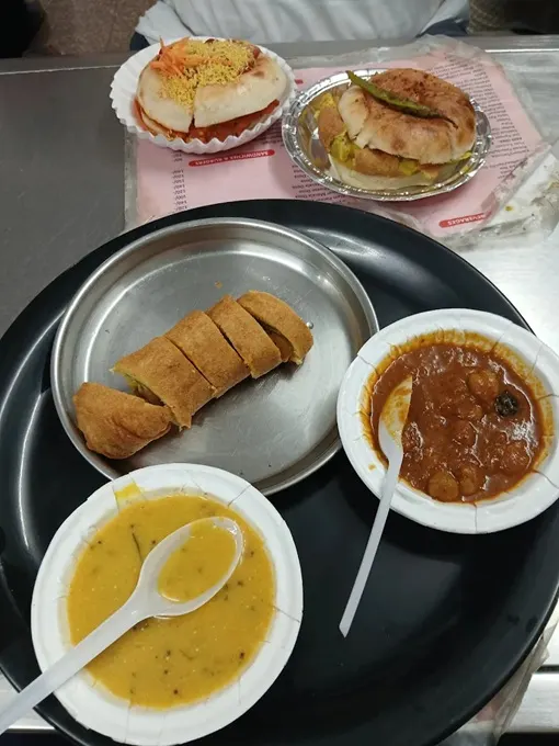 A table laden with assorted snacks in Jaipur, India