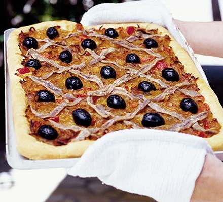 a pissadeliere is a french onion tart topped with olives and anchovies