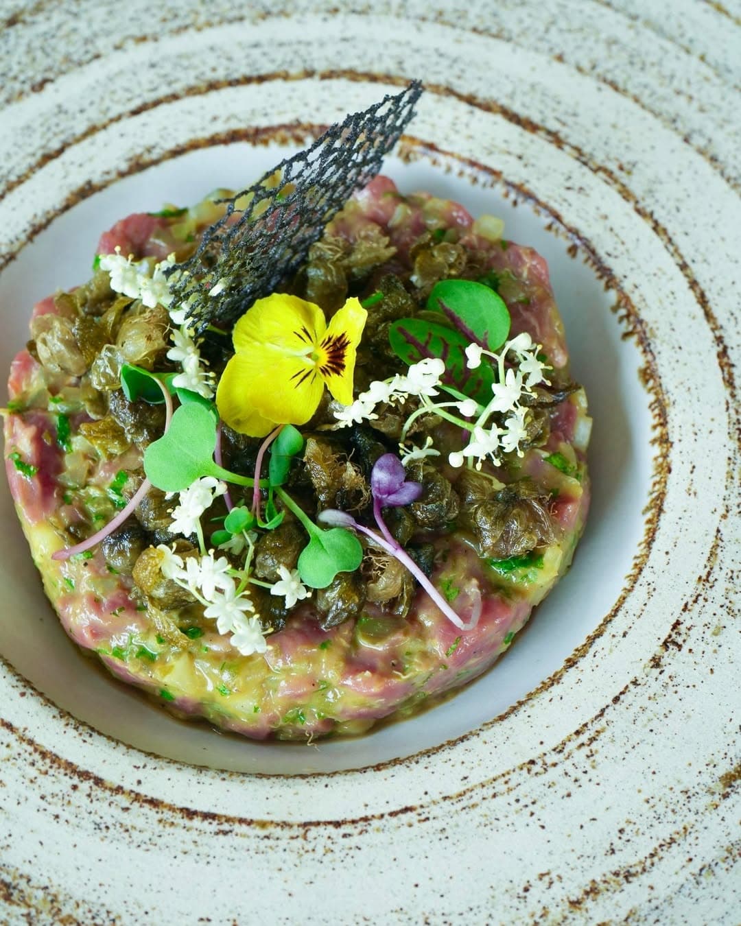 Tuna and avo tartare with a decorative tuile