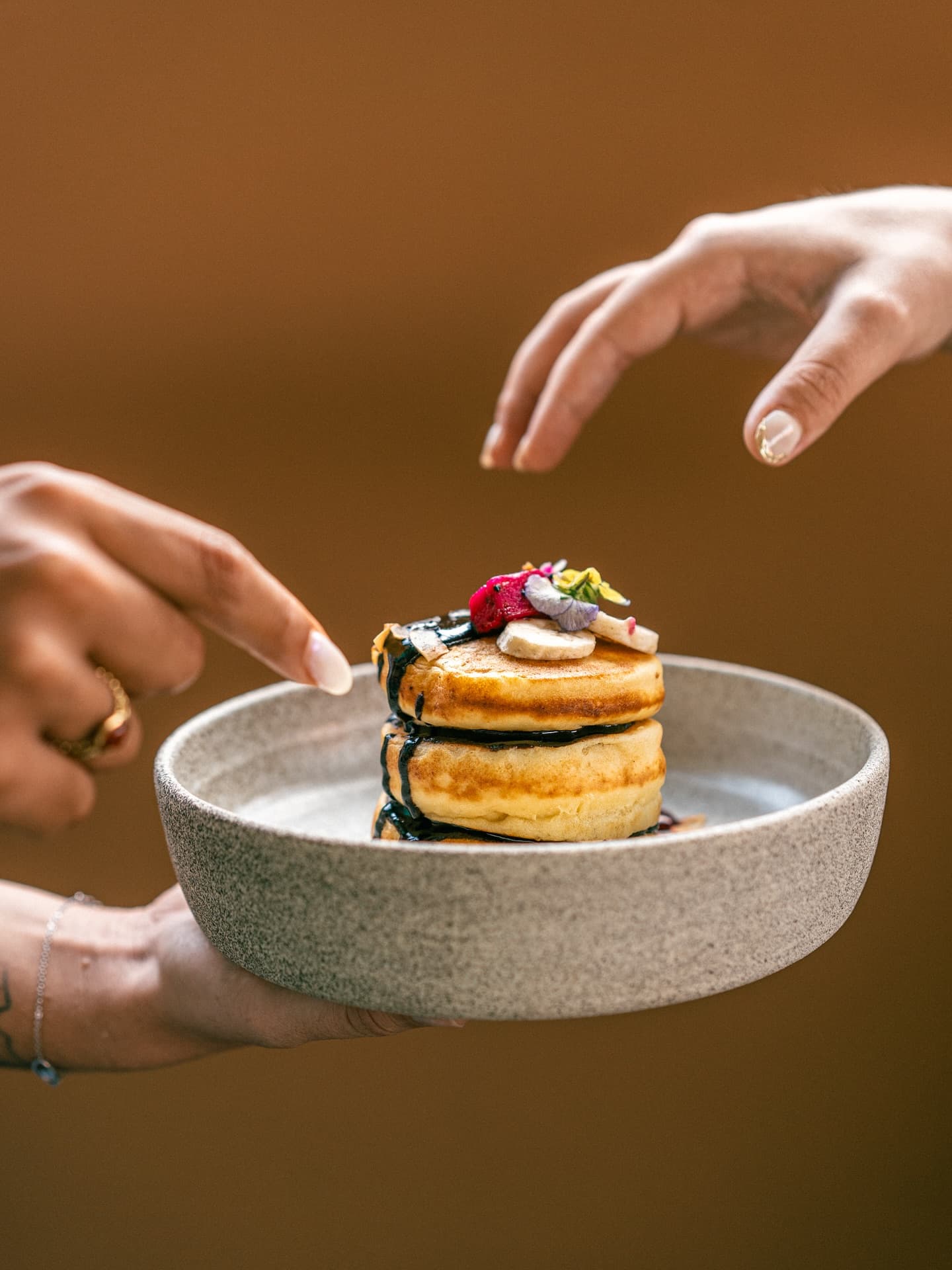 Breakfast pancake stacks topped with fruit