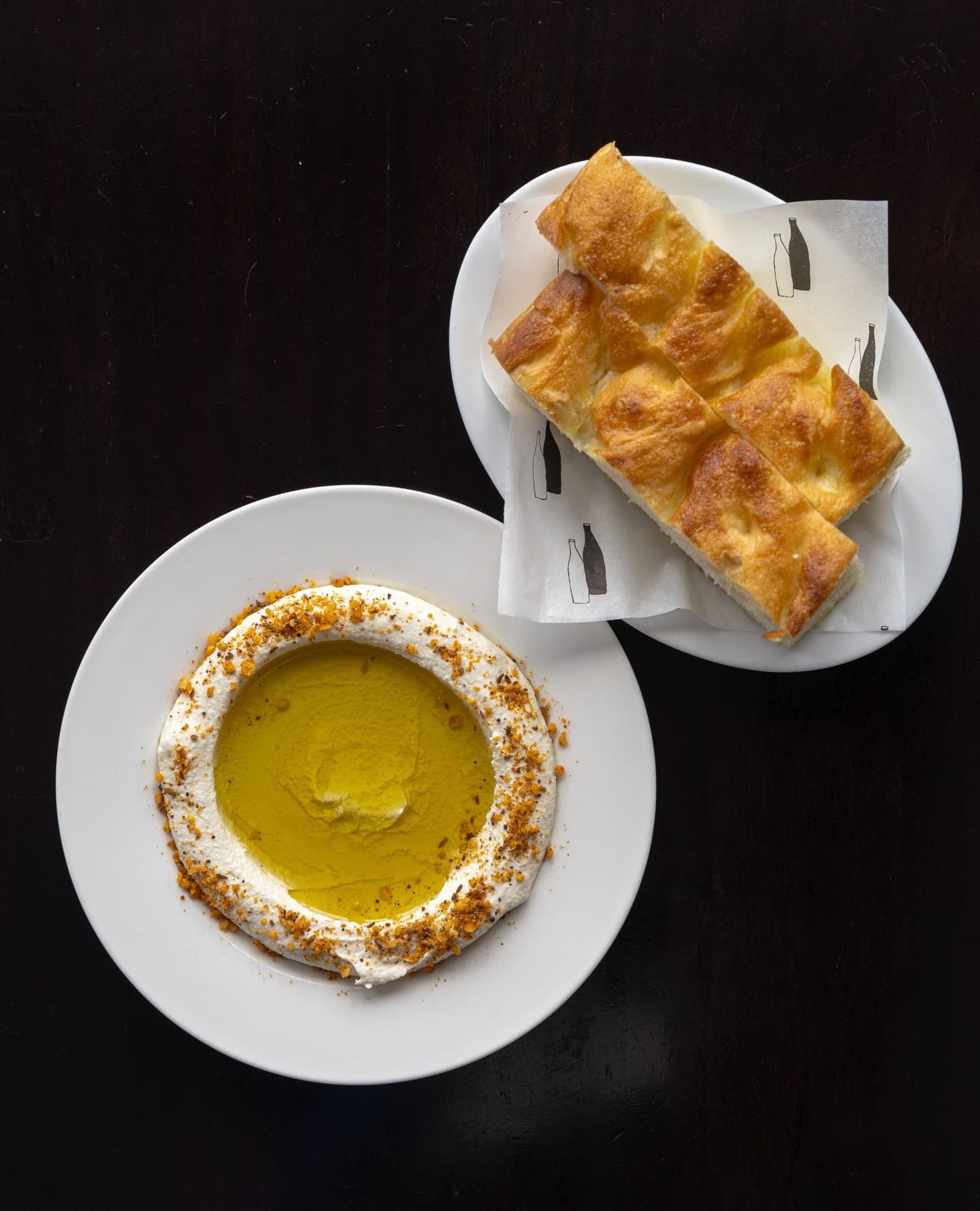 almond tarator, charcoal oil, and peanut duqqa served with focaccia