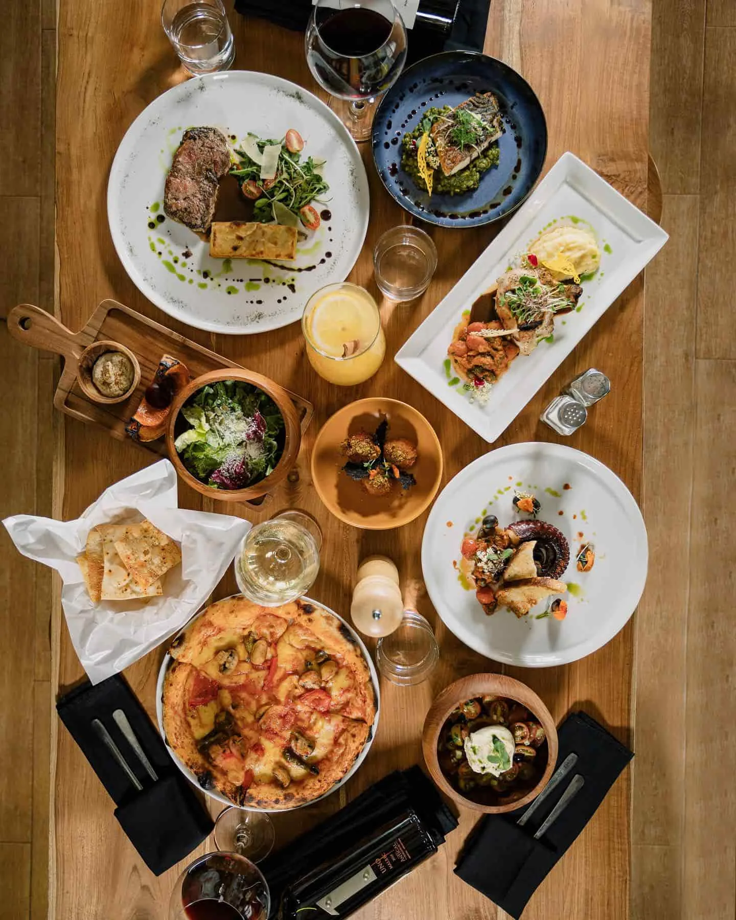 A selection of dishes available at Cantina including pizza and grilled ocotopus