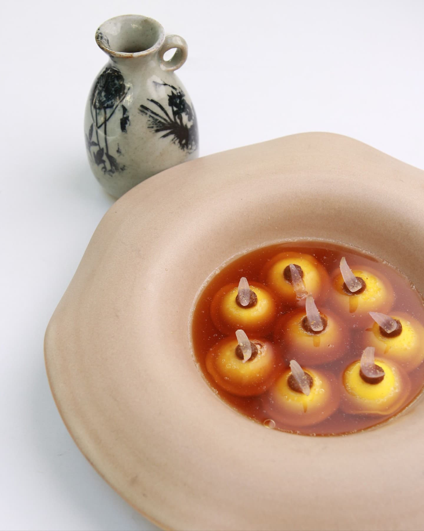 ravioli in an onion consomme