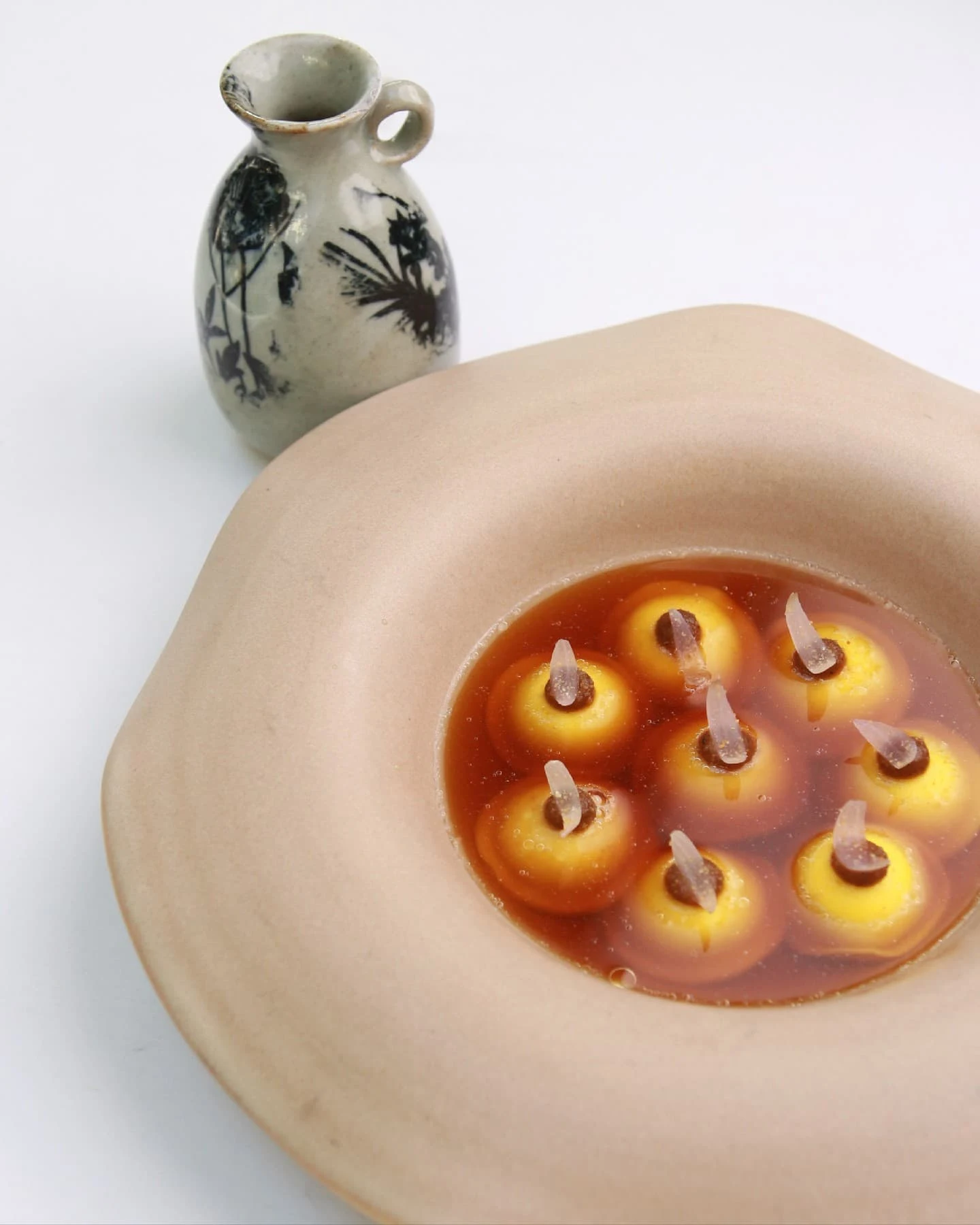 ravioli in an onion consomme