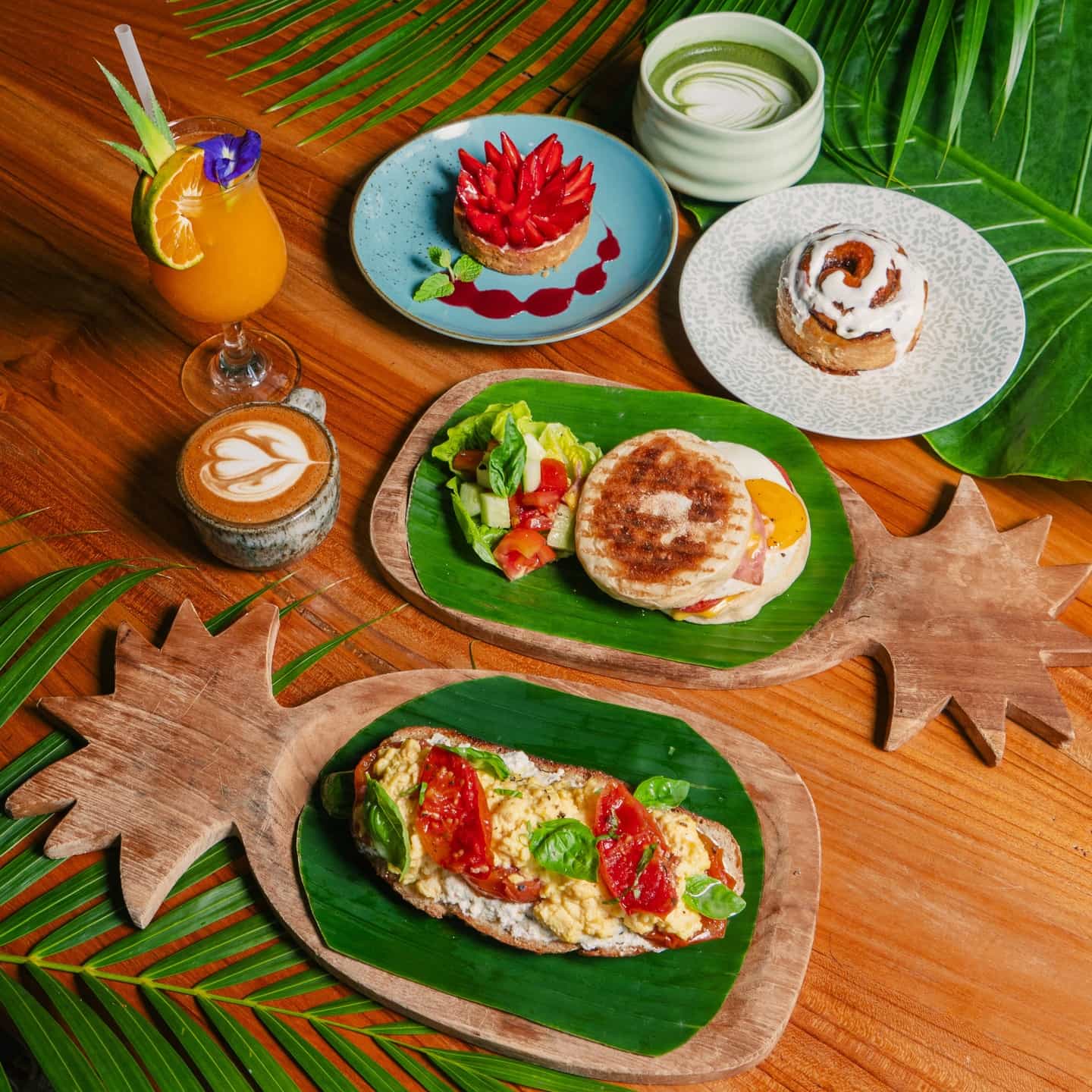 An array of breakfast options, matcha and cappuccino