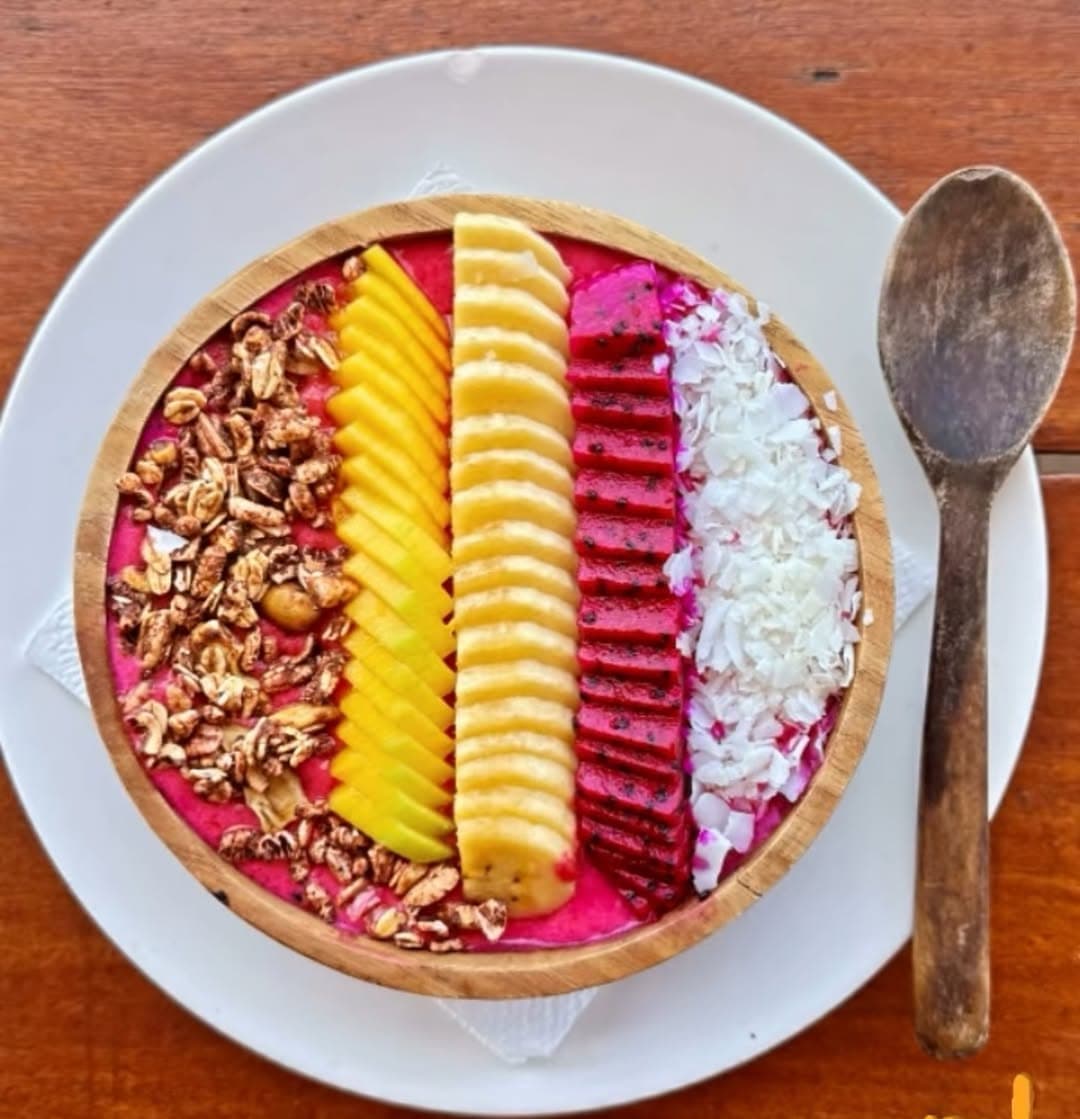 Smoothie bowl with dragon fruit, pineapple, coconut and banana