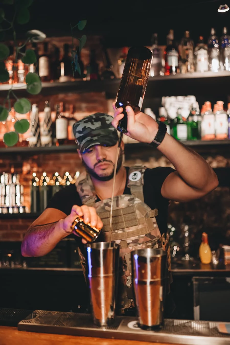 a barman dressed as a soldier at bunker cocktail bar in madrid spain