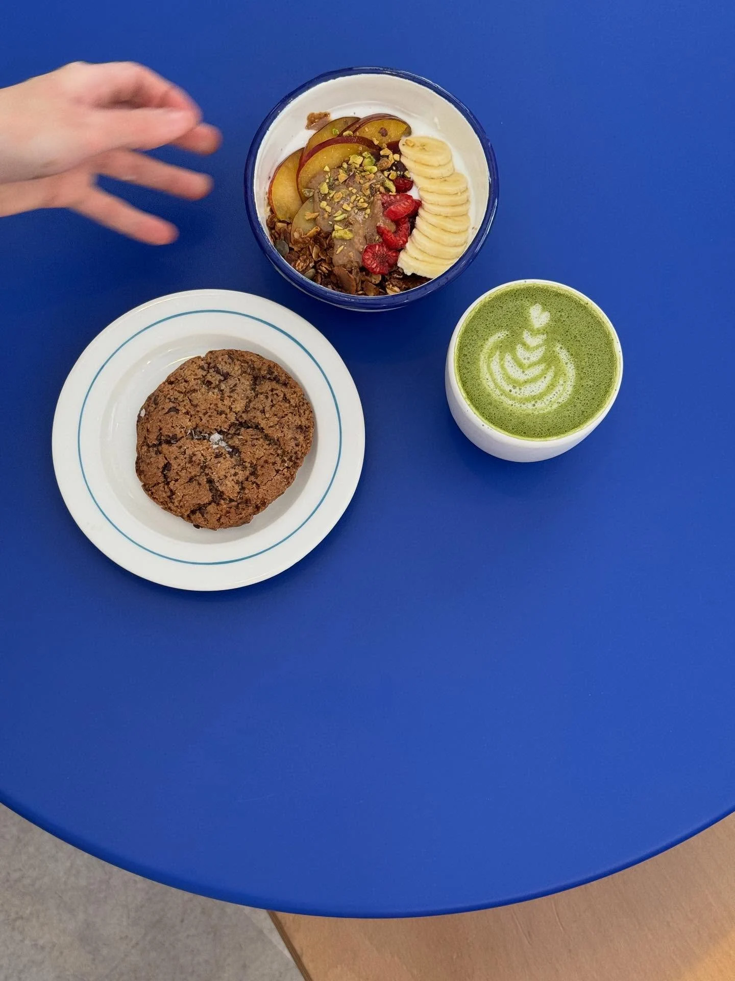 a chocolate cookie and breakfast fruit bowl from etual cafe in madrid spain