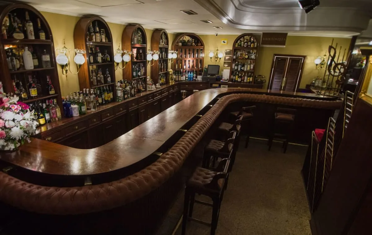a curved wooden bar at toni 2 piano bar in madrid spain