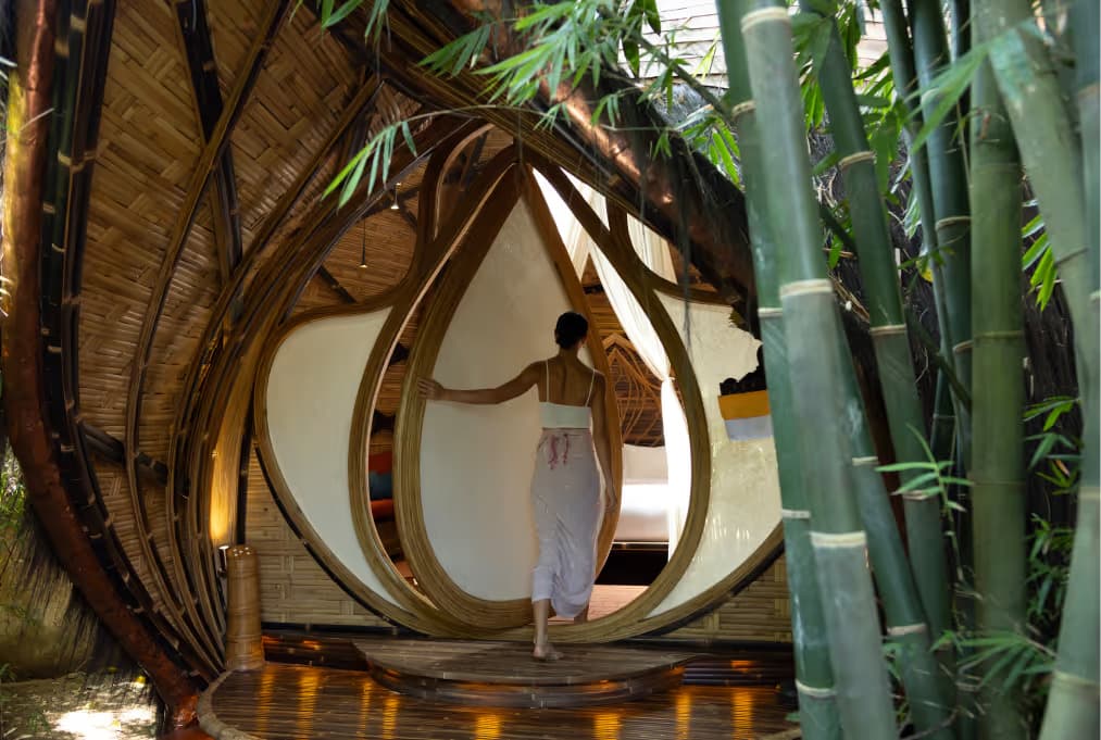 Woman walking through the teardrop shaped door into stay