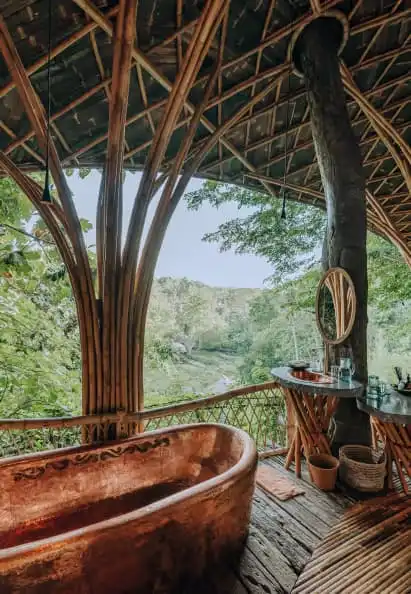 Copper bronzed bathtub in open-plan balcony