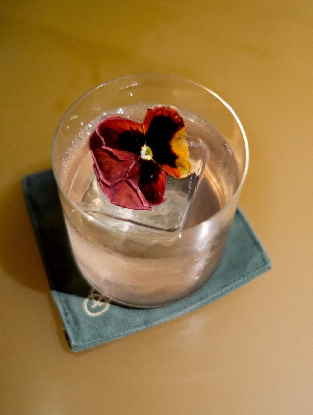 One of the bars latest cocktails, served with an edible pansy flower