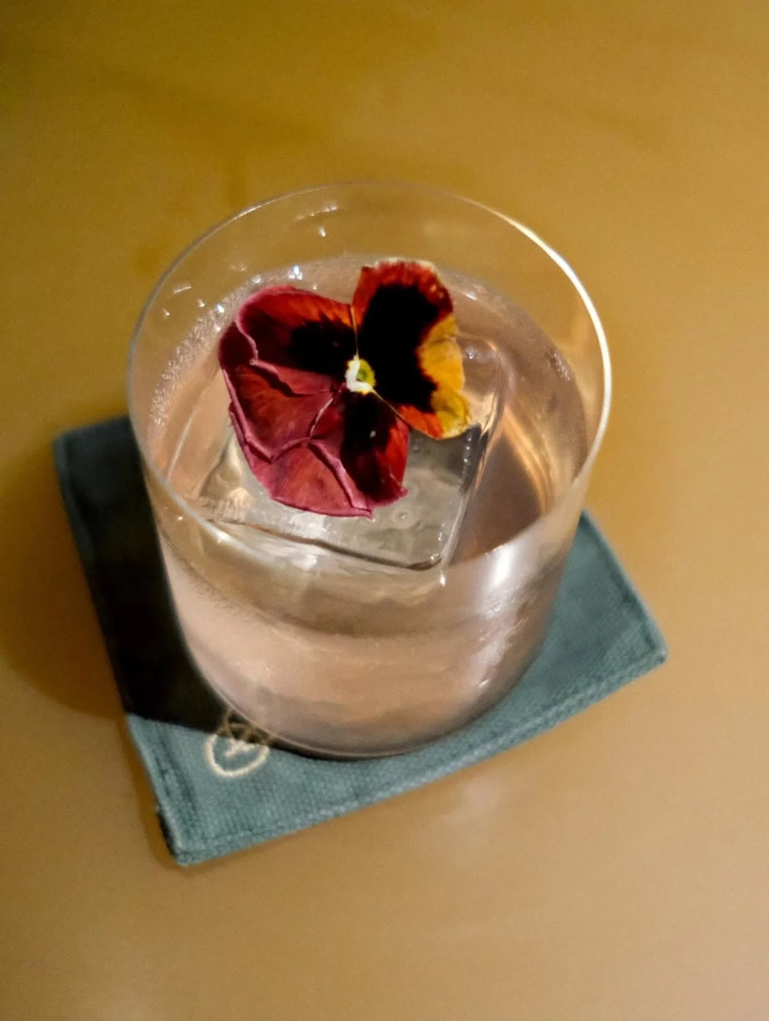 One of the bars latest cocktails, served with an edible pansy flower
