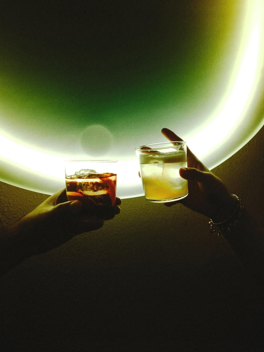 Classic cocktails illuminated by the bar's etxra cool lighting, seen all around the place