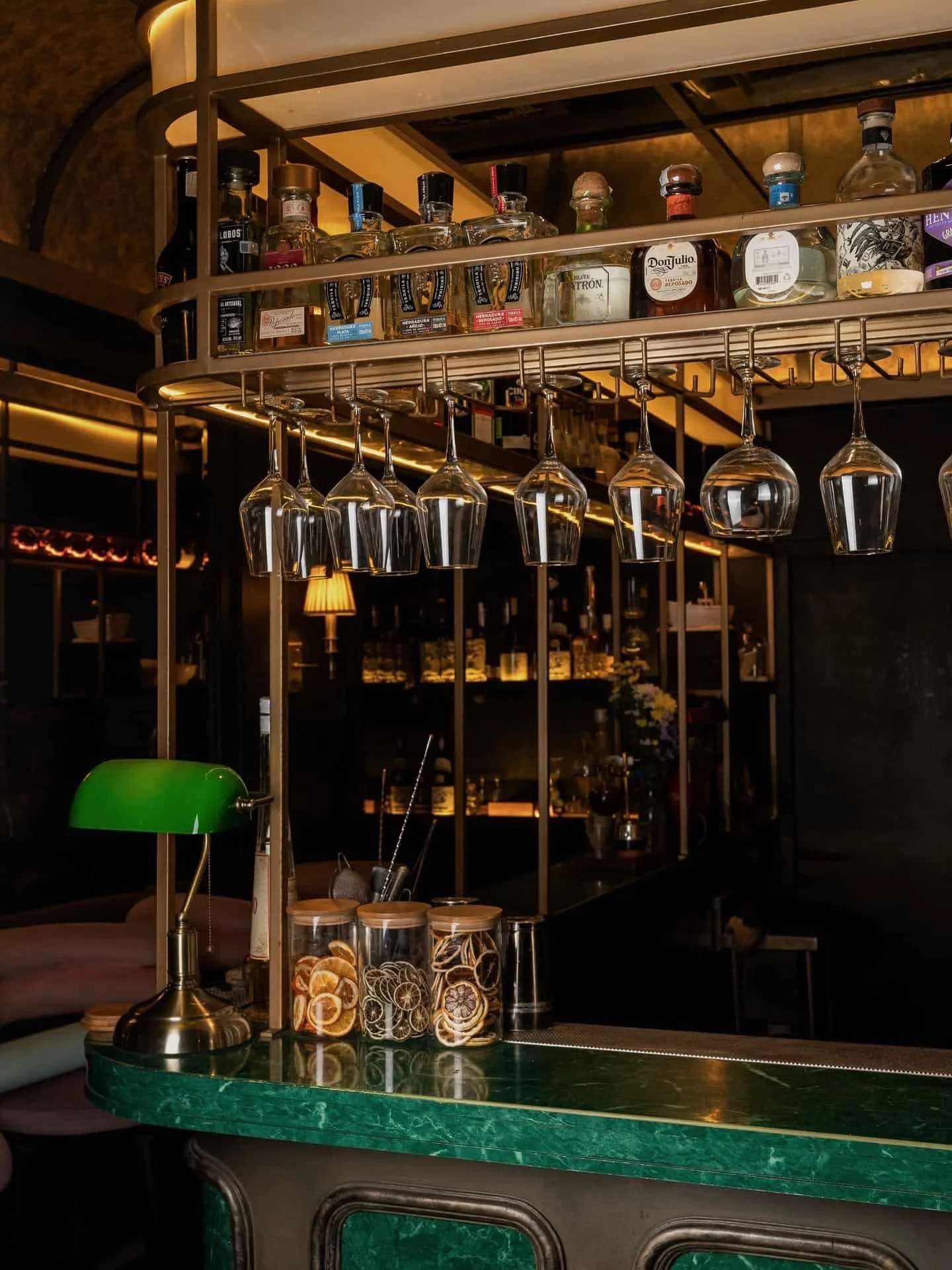 Green marble countertops around the stylish bar