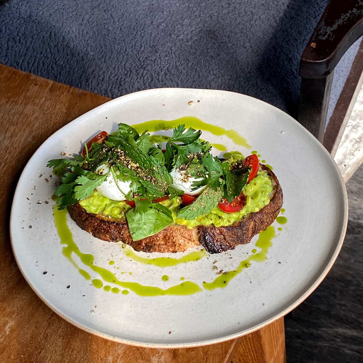 Smashed avo on sourdough with poached eggs
