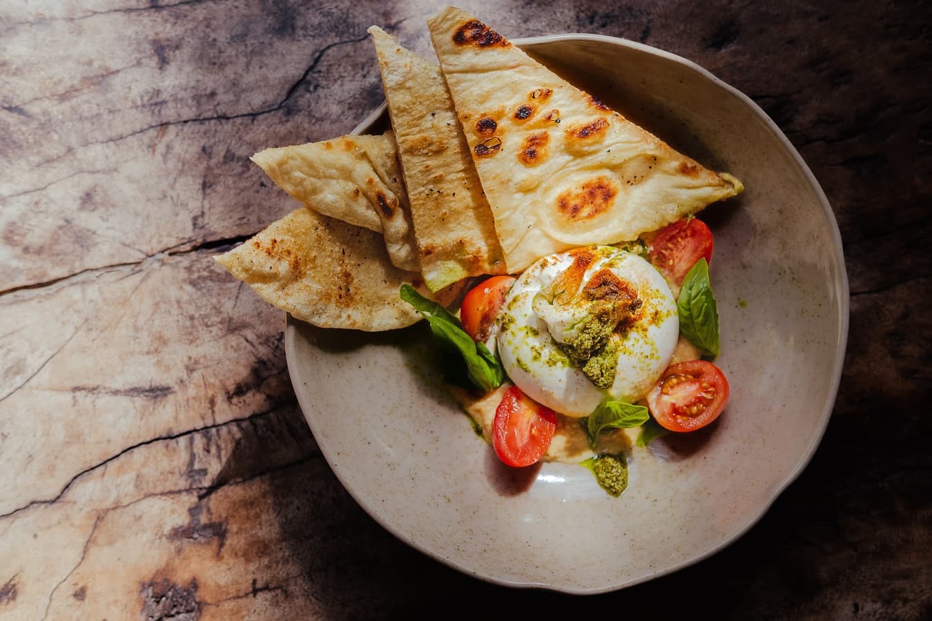 Buratta, pita, basil pesto, hummus, cherry tomatoes