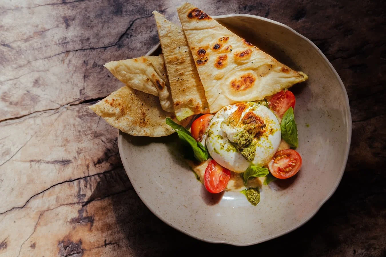 Buratta, pita, basil pesto, hummus, cherry tomatoes