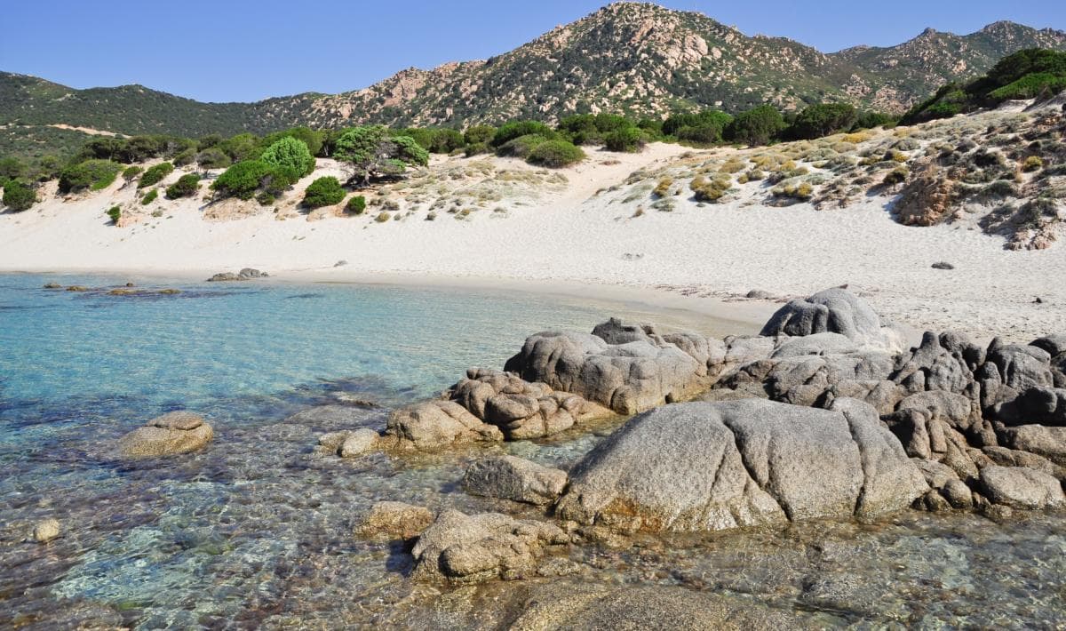 a secluded cove and sandy beach in porta sa ruxi the first stop on a sardinia itinerary after leaving cagliari