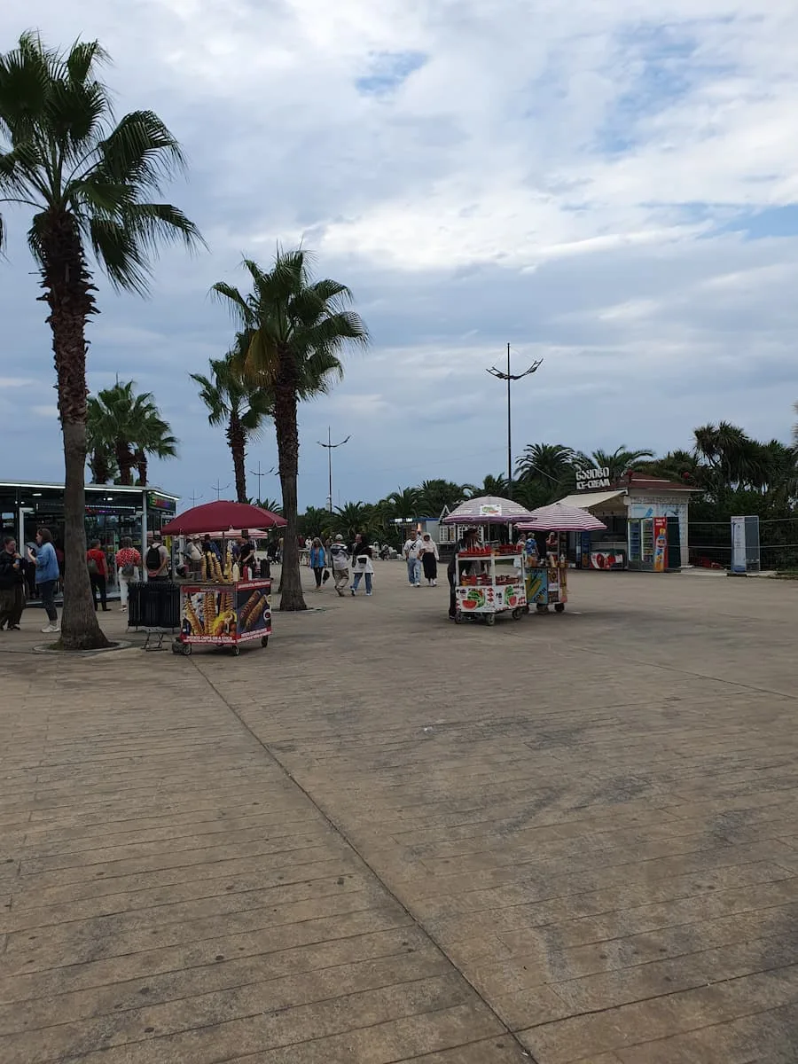 street food stalls beside palm tress on batumi boulevard in adjara georgia